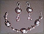 Sterling chain, filigree & stardust beads w/Swarovski crystals on antique repurposed faux tortoiseshell disks with faux silver turtles. These were once part of a necklace of my mother's that I inherit