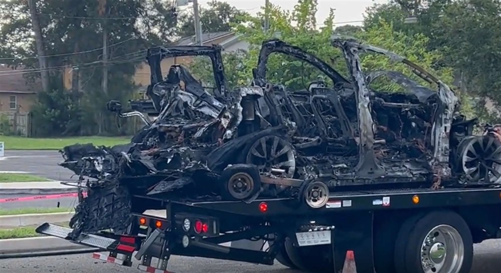 Tesla charred remains hauled away 