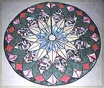 My Stain glass technique Christmas Tree Skirt from a pattern designed by Bear Paw Productions.  Fabrics chosen to fit my decor, the center is a South Africian sun print.