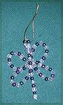 This beaded dragon fly is an adaptation of a design from MacEnterprises, marketed by Herrschner’s. Dragonfly fashioned by Madeline Wallace

2001 Ornament Swap
