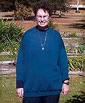 This is a picture of Duck modeling a sweater made by Lona Wilson.
This is a London Body Sweater done in teal.  It is absolutely GORGEOUS.
I had great fun wearing it to work and showing it off. I was