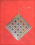 This “Stained Glass Double-Sided Ornament” was designed by Sue Stehle of Sekas and Company. The design appeared in the 2000 Just Cross Stitch Ornament issue and was stitched by Liz Boily.2001 Ornament