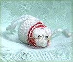 Micki’s knitted this for our non crafting duck. This ornament is a mouse knit from Meg Swanson’s Catnip Mouse pattern in the Fall 1992 issue of Knitter’s. This cute mouse is wearing a red and white sc