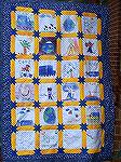 Quilt made by Becky Craft and 4th grade class using Crayola fabric crayons (iron on image) for their "Trucker Buddy" (pen pal consultant on topics ranging from geography to weather).Crayon Quilt 2Back