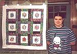 This is a quilted wall hanging done by my 13 year-old daughter Jessica in the summer of 2001. I embroidered the flower sqares on my Babylock and Jessica did the rest of the wall hanging.Jessica''s Qui