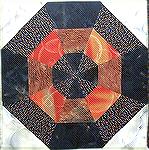 This block is a modification of a block from Barbara Brachman's book "Create Your Family Quilt". The original is made up of 60 degree and 30 degree triangles and two uneven strips on each.  The puzzle