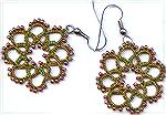 These earrings were tatted using 3 strands of cotton machine embroidery thread.  The thread colors are two shades of green and a rust.  The beads are size 11 seed beads in a color called "autumn" (sor