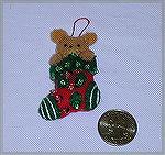Wendy Durell's ornament in our 2002 Holiday Ornament Swap.  A little tiny teddy bear in a stocking!  Made from a kit.Wendy Durell ornament 2002ChristinaNorton