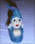 Ornament by Micki McCrillis for the 2002 Holiday Ornament Swap.  This little lady gnome is needlefelted from 100% Romney wool.  Each gnome is unique and individually sculpted.Micki McCrillis ornament 