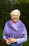 This is my mother, modeling the scarf she got for Christmas.  The scarf is 2/2 twill, woven of fine cotton yarns from Venne Colcoton-Unikat.  The colour gradation is all in the warp.Mom''s amethyst sc