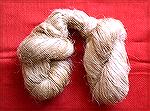 This is a "strick" of fiber that was sold as hemp, but which turned out to be flax.  (A "strick" is a bundle of fibers still in the arrangement in which they came from the hackling process).  The fibe