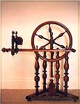 This spinning wheel came from the part of France known as the Morvan -- centrally located and far from any large cities.  I've seen photos of nearly identical wheels taken at the end of the 19th centu