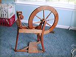 Here's a picture of my spinning wheel, finally IN the house instead of banished to storage in the garage!  I believe it's an Ashford Traditional wheel.  I hope to re-learn spinning someday soon.My Spi