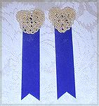 Bookmark submitted by Becky Morgan for our 2003 Beverly Marchetti Bookmark Swap.  A blue velvet ribbon topped with a crochet lace heart.