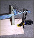 This shows the way the "far end" of a tablet-weaving warp is anchored in my little setup.