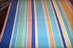 View shows all colors of tablecloth woven by Ramona Abernathy-Paine. Fibinacci numbers used to determine stripe width and spacing. Colors come from Fiesta Ware. 