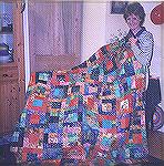 When I showed this quilt to my mum she said, 'Yes dear that's quite challenging' and that's what it's been known as since. It's being modelled here with its new owner, my cousin, who received it on he