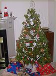 Here is our tree with tatted items, ornament exchange ornaments, etc., and a few gifts around the bottom.