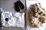 This photo shows the amazing amount of stuff that can be packed into vacuum storage bags -- and shows how valuable they can be to someone with a big fiber stash.  To give you a sense of scale, the pil