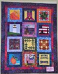 This quilt shows the blocks described in my review of the 2004 Atlanta Shop Hop.  This one was made by the In-Town Quilt shop and reflects their preference for batiks.  I share it since my description