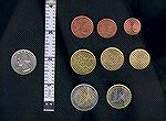 These are the &quot;coins of the realm&quot; in the Euro monetary system.  The coins in the top row (the coppery-coloured ones) are worth 1, 2, and 5 Euro-cents.  In the middle row, these brassy coins