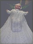 This is a pretty full view of my christening gown on a life size baby doll.