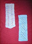 Alana Beyea's bookmarks, submitted in our 2004 Beverly Marchetti Memorial Bookmarks for literacy swap.  Vine lace and diagonal lace knitting, modified from a pattern by Darilyn Page at pagebypage.com.