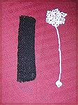 Bookmarks submitted by Dawn Wheeler in our 2004 Beverly Marchetti Memorial Bookmark Swap.  The black bookmark is Dawn's own design in knitted seed stitch, and the white one is crocheted from Julie A. 