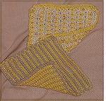 These dishcloths were done in double-hook crochet using Bernat Handicrafter Cotton.  They come from Darla Fanton's book &quot;Scrubbies&quot;.  I learned the technique from Darla when she taught at th