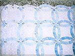 Close up of the corner section of my blue and white Double Wedding Ring quilt.