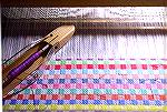 This photo shows the twill blocks warp being woven with a colour change at each shift between blocks.  It's the first warp on my Kombo (which was Ans' Kombo, so has been well trained already) -- and i