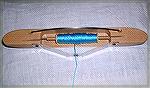 This is the &quot;Flying Dutchman&quot; shuttle from Louet -- but that's not why I'm uploading this photo.&lt;g>

This is a &quot;fix&quot; for noisy bobbins.  Take a cardboard quill, break it in ha
