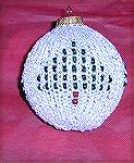 This knitted, beaded ornament cover is by Anne Roza, from a kit by Ornamental Kits.  From our 2004 Holiday Ornament Swap.