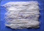 This is a batt (blending wool fiber and silk threads) after just one round of drum carding.

I think it looks much the same as a batt that comes off a hand card after the first round of carding.
