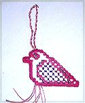 This hardanger cardinal is from New Zealand Creative Stitch and Craft.  Karen says it was orignally intended as a dove, but she stitched it as a cardinal, as she thought the bird looked more like one.