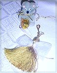 The little mouse with the package and the tassel angel are Colleen's own design.  From our 2005 Holiday Ornament Swap.