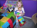 This is my grand daughter with her quilts