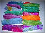 I tie-dyed some silk hankies (unspun silk fiber) with Easter egg dye after my son had finished his eggs.  I wadded up the hankies and stuffed them into the dyebaths my son was using, and then microwav