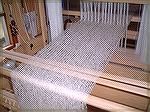 This is a view of the back beam on Ans' loom.  The mohair warp is so nice and orderly that it's hard to imagine....  (My own warps are orderly, but rarely this beautiful!)
