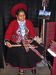 This is my "spinning friend" Maria weaving at Convergence 2006 in Grand Rapids.  Her loom is made of sticks and string; with it, she's weaving complex fabric.

Maria is from the village of Chinchero