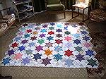 This is a picture of my layout for the centre of my pyramid star quilt prior to the next stage of construction.

Catriona, Edinburgh
