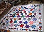 Following the addition of my diamond border I've come to think of my quilt as stars and jewels. This picture is of it at layering stage.

Catriona, Edinburgh