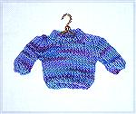 This little knitted sweater is based on a design by Betty Lampinen.  Micki says she's working on a top-down version of this!  From our 2006 Holiday Ornament Swap.