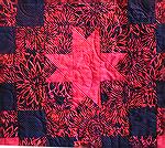 This is a close up of 1 block in the quilt top. It is a pattern from the 2nd Batik Beauties book.