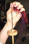 This is what happens when you take silk mill waste and spin it into yarn.  It's slippery stuff and takes a LOT of twist!
