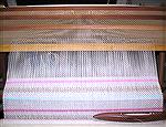 This plainweave towel is part of an effort to tidy my living area &lt;G>.

The warp is 10/2 mercerized cotton, threaded in crackle; the wefts are 22/2 cottolin (the beige part), handspun heavy tow l