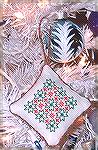 This adorable ornament is called "Holly" from New Stitches, issue 66. It was stitched by Karen Willett. It is stitched in traditional Christmas red and green colors.

Karen Willett/2007 Holiday Oran