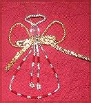 This enchanting angel was done by Colleen Poor and is of her own design. She used various beads, wire, and ribbon to create this beautiful angel.

Collen Poor/2007 Holiday Ornament Swap