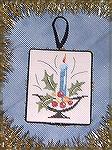 This cross stitched design was stitched by Nancy Kuelbs for the 2008 Ornament Swap. She stitched this design from a 2008 design from Brittercup Designs in the Just Cross Stitch Magazine. Nancy loved t