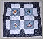 This is another quilt made by my daughter Rebecca and myself this week. The embroidery designs are a Dakota Collectables collection.

Kyra